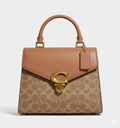 CARTERA DE PLASTICO MARRON CON MANCHAS