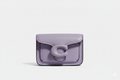 CARTERA DE PLASTICO MORADO