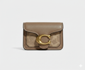 CARTERA DE PLASTICO MARRON CON DORADO Y MANCHAS